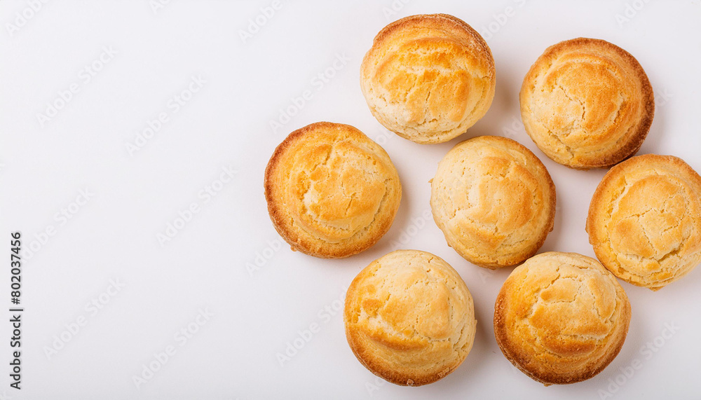Freshly baked buttermilk biscuits on white table. Tasty cookies. Delicious snack. Homemade bakery. Freshly baked buttermilk biscuits on white table. Tasty cookies. Delicious snack. Homemade bakery.