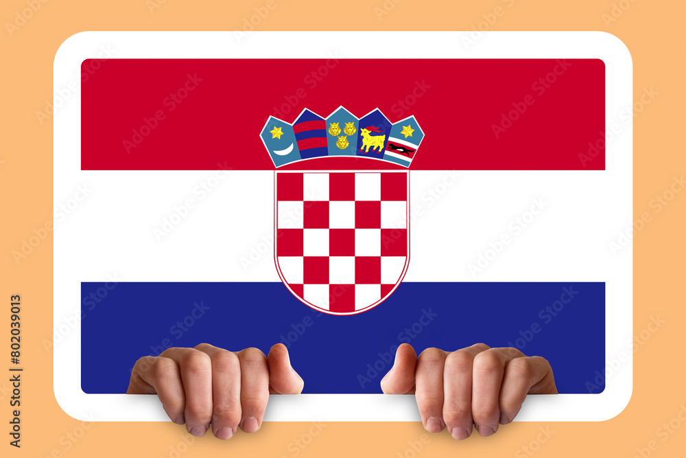Naklejka premium Hands holding a white frame with Croatia flag, two hands and frame, celebration or campaigning 