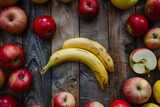 Zwei Bananen umrandet von Äpfeln