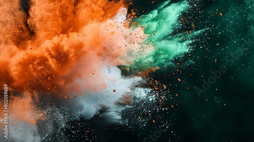 Colored powder explosion. Green, white and orange colors dust on black background. Multicolored powder splash background © Zainab