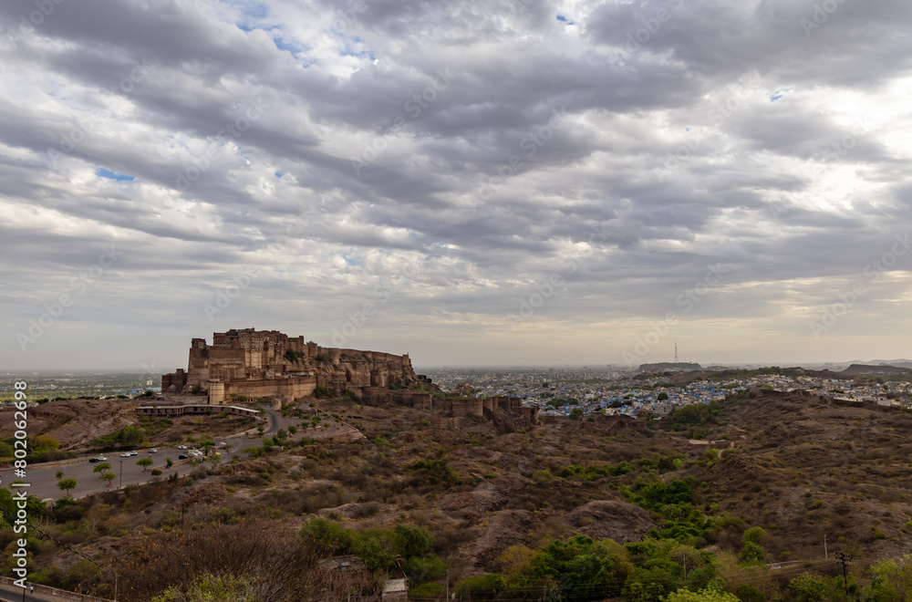 ancient historical fort with dramatic cloudy sky at evening from flat angle