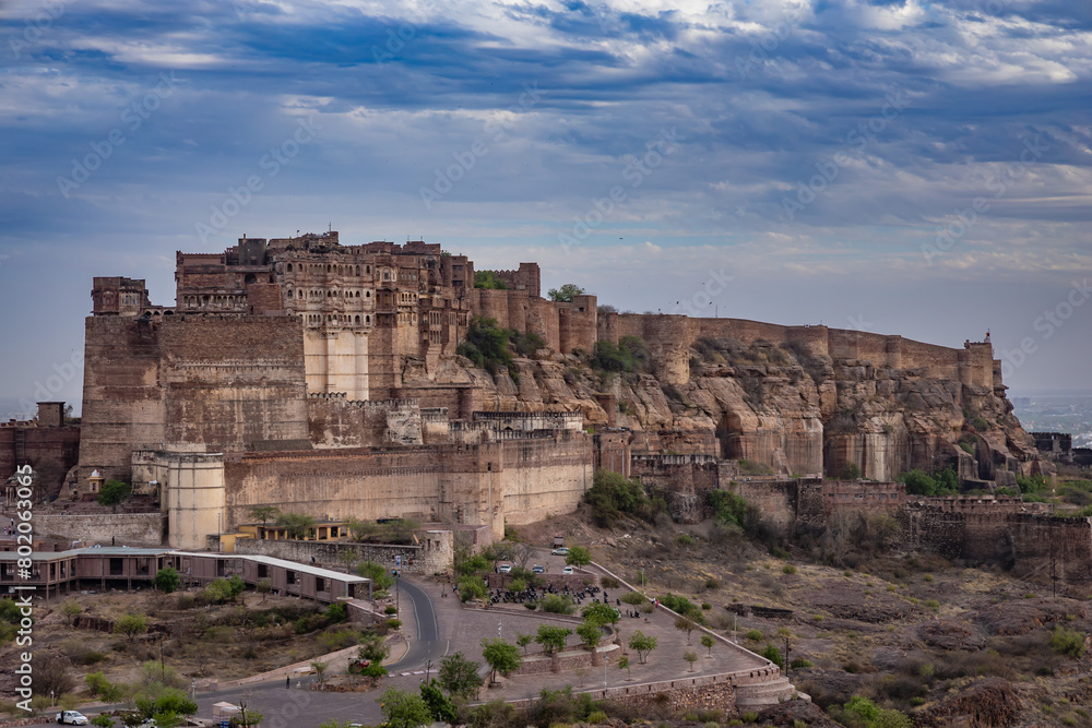 ancient historical fort with dramatic cloudy sky at evening from flat angle