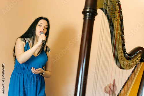 Opera singer rehearsing with a harpist