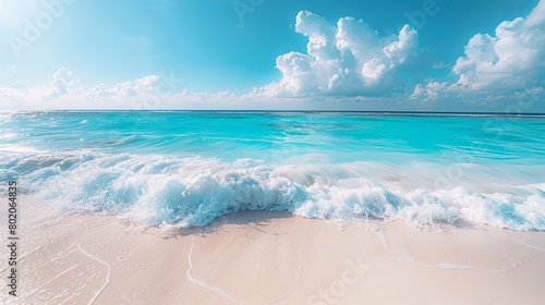 Panorama of a beautiful white sand beach and turquoise water in Maldives. Holiday summer beach background.. Wave of the sea on the sand beach