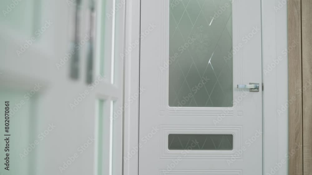 White interior door. Beautiful white door in the interior of a door sales salon. Door salon. White door. White interior door. Beautiful white door in the interior of a door sales salon. Door salon. White door.