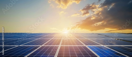 Sunset sky background with solar panels on the ground