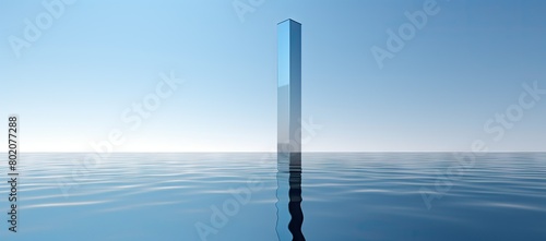 Tall pole in the middle of large body of water