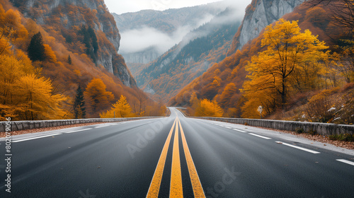 Road Stretching into Autumn Mountain Landscape.