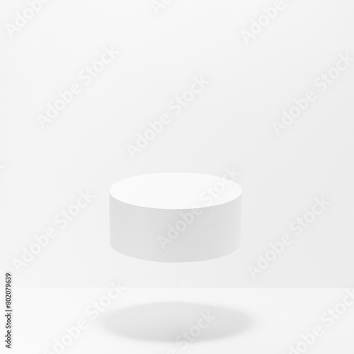Abstract scene - one round white cylinder podium for cosmetic products mockup, fly in hard light, shadow on white background. For presentation skin care products, gifts, advertising in minimal style.