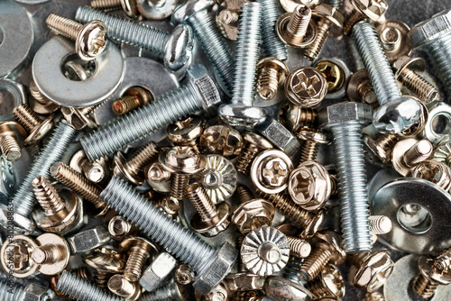 Mixed screws and nails. Industrial background. Home improvement.bolts and nuts.Close-up of various screws. Use for background, top view. © bukhta79