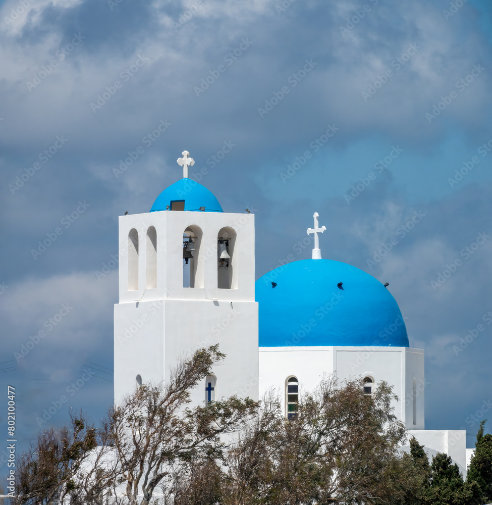 Typical blue-domed christian orthodox church in Fira, Thira island, Santorini, Cyclades islands, South Aegean Sea, Greece