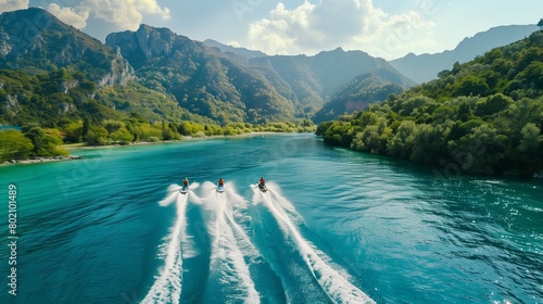 A group of friends riding jet skis across a sparkling blue lake, leaving trails of white foam in their wake. © Eric