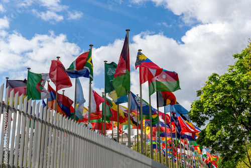 Flags fluttering in the wind in front of the UNESCO (United Nations Educational, Scientific and Cultural Organization) headquarters at 7 place de Fontenoy in Paris.
