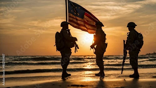 Soldiers walking on the beach with usa flag
