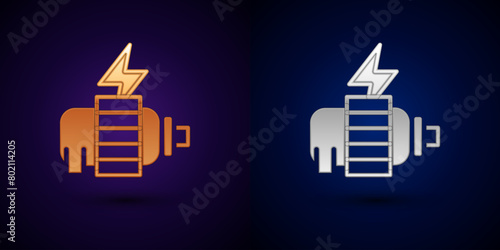 Gold and silver Electric motor icon isolated on black background. Vector