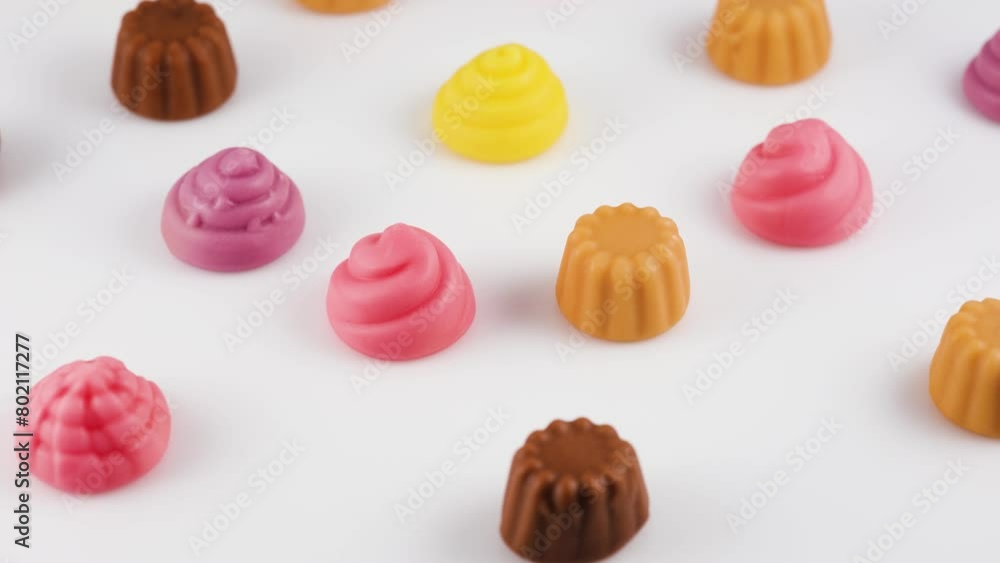 delicious jelly candies in shape of meringue and cupcake on white background. delicious jelly candies in shape of meringue and cupcake on white background.