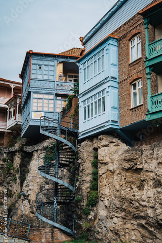 Spiral staircase going from traditional Georgian houses with carved wooden balconies to the Leghvtakhevi Canyon in Tbilisi old town, Kala (Georgia) photo