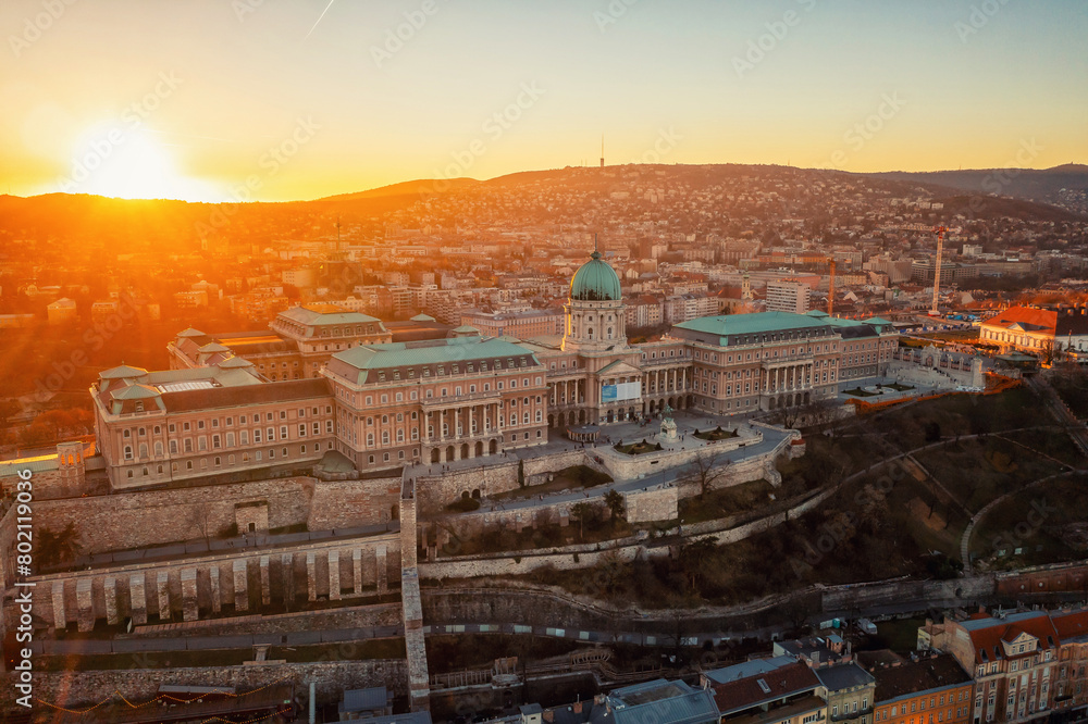 Fototapeta premium Sunset view of parliament, buildings and city. Dramatic evening view in Budapest, Hungary, Europe.