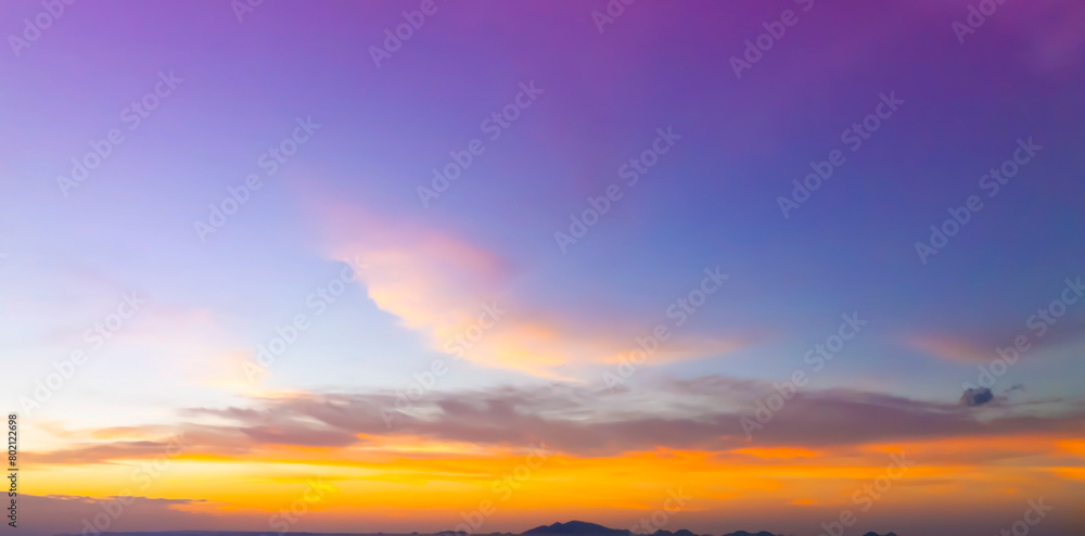 Naklejka premium Sunset Sky on the beach with Twilight in the Evening as the colors of Sunset Horizon scene