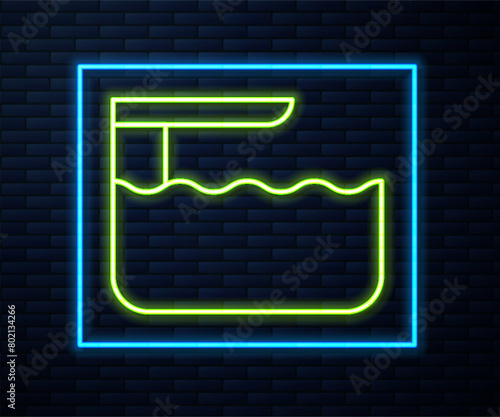 Glowing neon line Diving board or springboard icon isolated on brick wall background. Vector