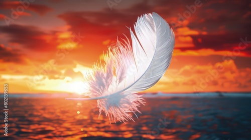 A vivid image of a vibrant white feather drifting in the air with a background of a bright, clear blue sky lit by the morning sun. photo