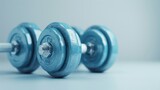 A set of dumbbells, symbolizing strength and fitness, against a clean white background
