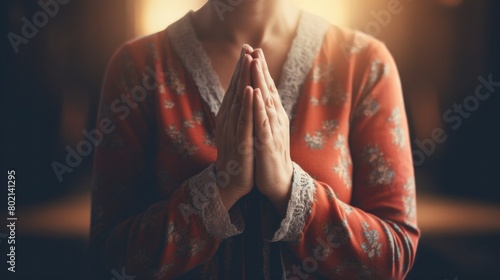 Female hands in prayer position in church Show humility and faith in God. photo
