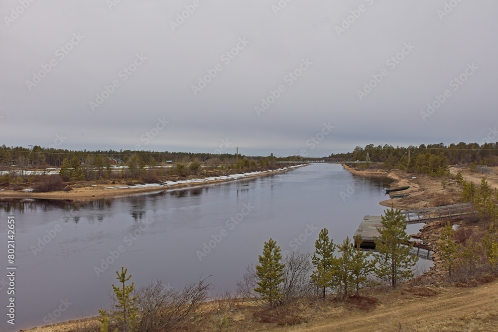 Landscape, view of Vuotson canal in cloudy spring weather, Lapland, Finland.