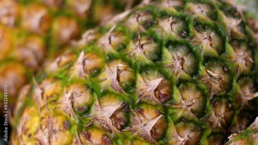 Close Up of Organic Pineapple on Supermarket Shelf. Camera moving smoothly showing Beautiful Ripe Fruits in Grocery Store Close Up of Organic Pineapple on Supermarket Shelf. Camera moving smoothly showing Beautiful Ripe Fruits in Grocery Store