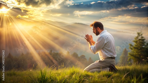 A man on his knees, in an attitude of prayer, while the sunlight shines on him, symbolizing revelation and obedience. In the background, a setting that refers to nature, transmitting serenity and clos © Sofia