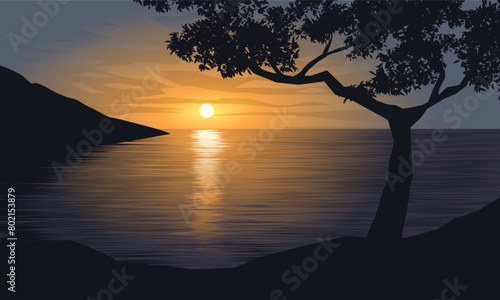 Beautiful view of ocean sunset from the hill with tree silhouette © Johnster Designs