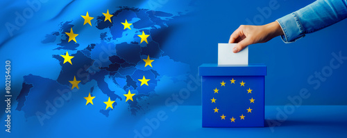 Voting for the European Union election, a hand putting a ballot paper into a ballot box on a blue background banner with Europe map on a twelve yellow stars flag photo