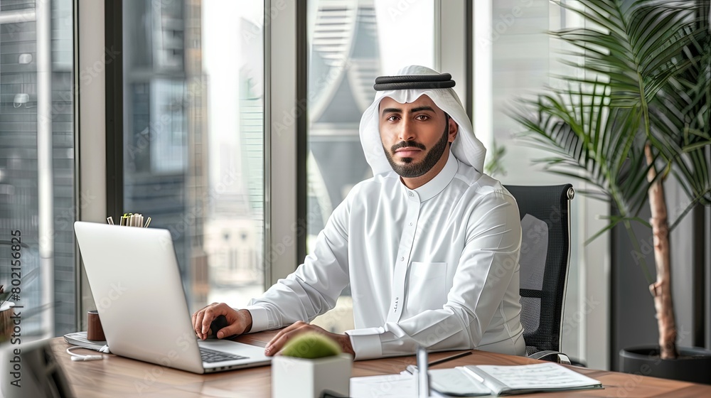 Stunning visual of a Middle Eastern manager at work, sitting at a stylish desk in a creative office space, showcasing leadership and elegance. Stunning visual of a Middle Eastern manager at work, sitting at a stylish desk in a creative office space, showcasing leadership and elegance.
