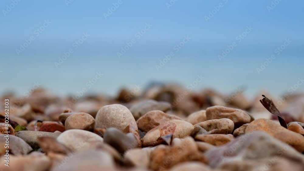 View of blurred Balearic sea from stony seashore. View of blurred Balearic sea from stony seashore.