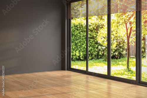 Empty room with black walls, parquet floor and view yard from window, simple minimalist interior architecture background with copy-space,