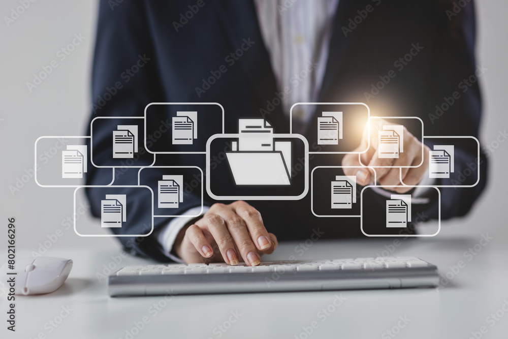 Businessman hands using a computer are typing on the keyboard and mouse, pointing at the device screen. Businessman hands using a computer are typing on the keyboard and mouse, pointing at the device screen.