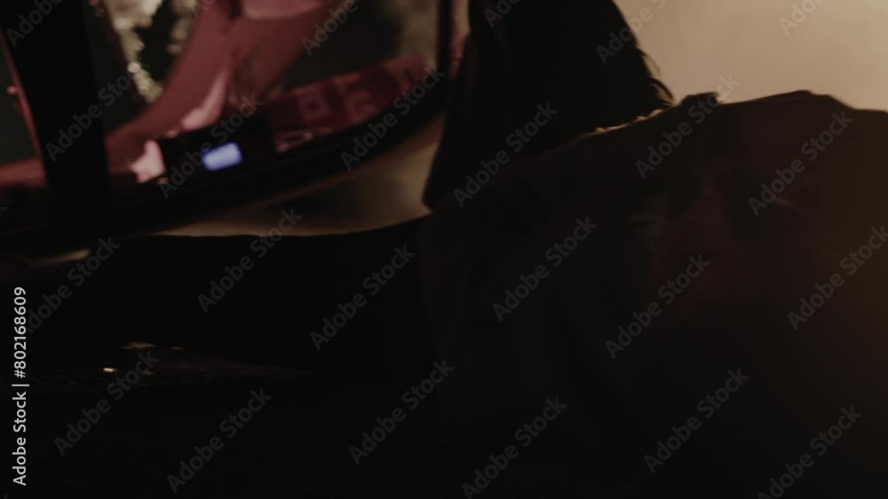 A man laying on the ground after a car crash A man laying on the ground after a car crash