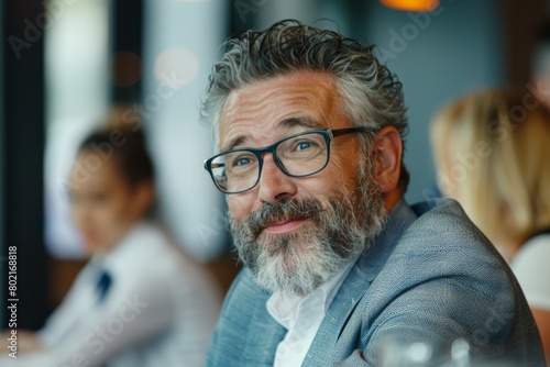 Portrait of senior business man with eyeglasses in a restaurant