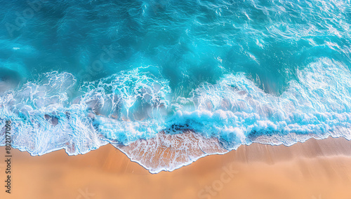 Aerial view of the ocean waves hitting against golden sand on an exotic beach, captured in high resolution with stunning clarity and depth. Created with Ai © Artistic Assets