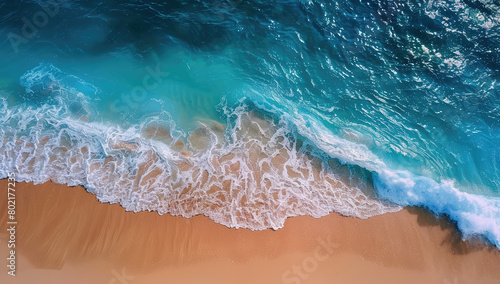 Beautiful aerial view of the ocean waves hitting against golden sand, captured from above with an overhead camera. Created with Ai
