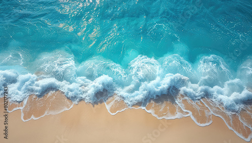  Aerial view of the sea waves crashing onto golden sand, creating intricate patterns and textures in shades of turquoise blue and white. Created with Ai © Artistic Assets