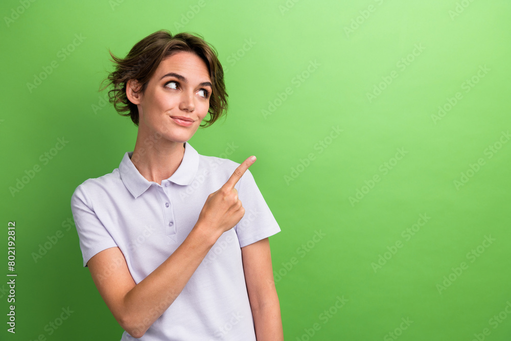 Photo of young girl investment manager point finger copyspace click website page check potential income isolated on green color background Photo of young girl investment manager point finger copyspace click website page check potential income isolated on green color background