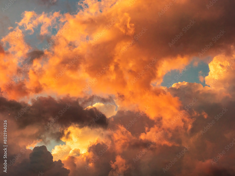 Fototapeta premium Gathering clouds with signs of an approaching storm during golden hour early in June in southwest Florida, for background with motif of changeability