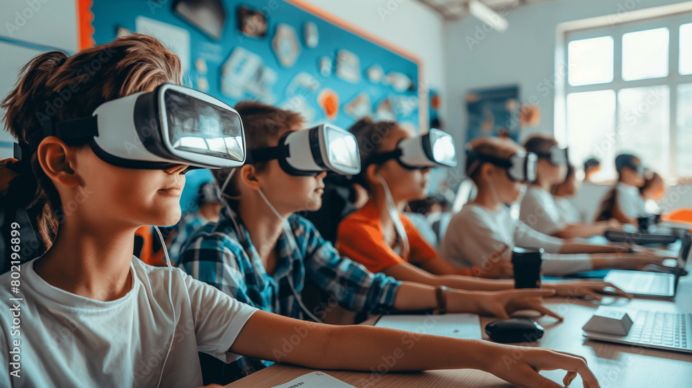  children are sitting in a classroom wearing virtual reality headsets. 