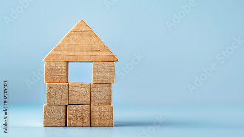 Fototapeta Naklejka Na Ścianę i Meble -  concept of a building savings contract, Wooden cube block puzzle house shaped wide banner with copyspace area 