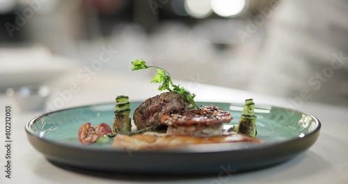 Restaurant, steak and plate with meat on luxury, gourmet or fine dining menu with spices and herbs. Grill, beef and catering dinner closeup with healthy protein, food or cooking in kitchen at hotel photo