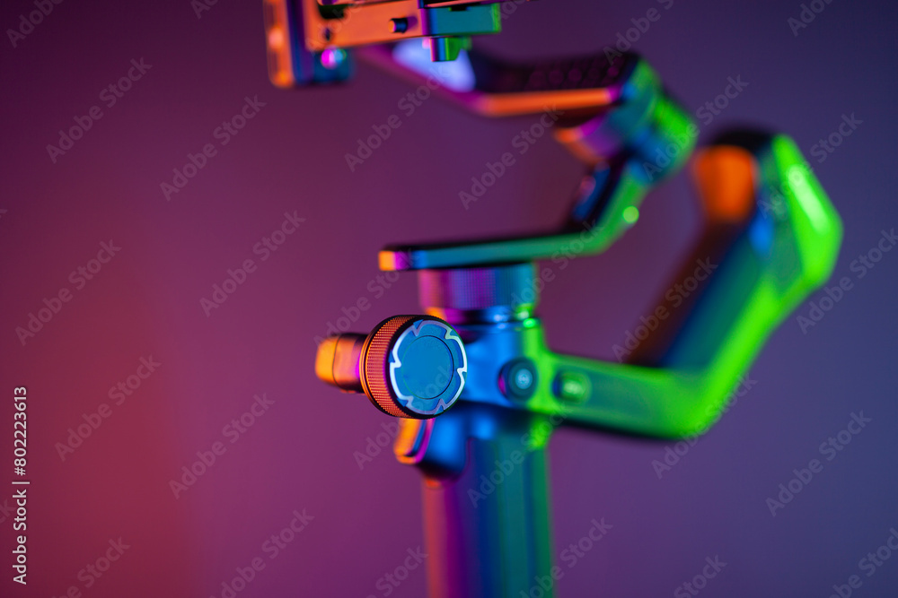Fototapeta premium Close up on a modern gimbal for videomaking, background is black.