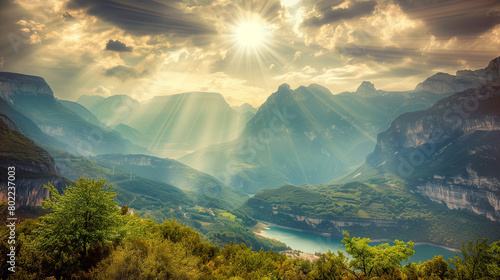 the sun shines through the clouds over a mountain landscape.