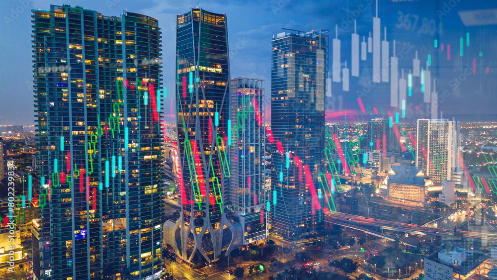 Fototapeta premium modern skyline cityscape at night with stock market chart candle stick trend 