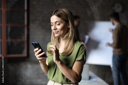 Beauty woman using smartphone at office